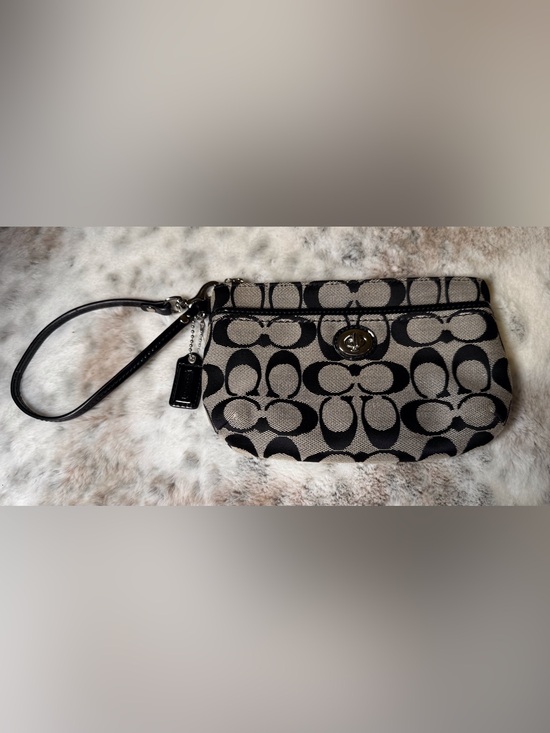 Coach Handbags - COACH Park Medium Black and Tan Signature Turnlock Wristlet.